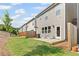 Cozy backyard features a patio and grassy area for outdoor enjoyment at 323 Hayden Circle Cir, Woodstock, GA 30189