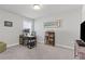 Bedroom furnished with a desk, shelves, and TV, offering a comfortable workspace at 323 Hayden Circle Cir, Woodstock, GA 30189