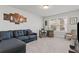 Versatile bonus room with comfortable seating and a window for natural light at 323 Hayden Circle Cir, Woodstock, GA 30189
