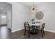 Dining area boasting a modern light fixture, adjacent to the front door and entry way at 323 Hayden Circle Cir, Woodstock, GA 30189