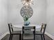 Cozy dining area with elegant lighting and rustic wood furnishings at 323 Hayden Circle Cir, Woodstock, GA 30189