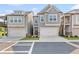 Charming townhome featuring an attached garage and craftsman style architectural details at 323 Hayden Circle Cir, Woodstock, GA 30189
