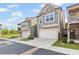 Beautiful townhome featuring an attached garage, green space, and a well-manicured lawn at 323 Hayden Circle Cir, Woodstock, GA 30189