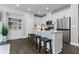 Well-lit kitchen with white cabinetry, stainless steel appliances, and a center island with bar seating at 323 Hayden Circle Cir, Woodstock, GA 30189