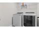 Convenient laundry room features a modern washer and dryer at 323 Hayden Circle Cir, Woodstock, GA 30189