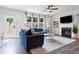 Inviting living room boasting bright windows, a fireplace, and hardwood flooring at 323 Hayden Circle Cir, Woodstock, GA 30189