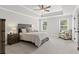 Spacious main bedroom featuring a tray ceiling, neutral decor, and large windows for ample natural light at 323 Hayden Circle Cir, Woodstock, GA 30189