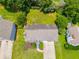 This is an aerial view of the home featuring mature trees, an expansive lawn, and a long driveway at 4255 Brandy Ann Dr, Acworth, GA 30101