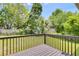 A backyard with lush green grass and a wooden deck at 4255 Brandy Ann Dr, Acworth, GA 30101