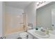 Bathroom featuring a standard shower-tub combo and a single sink vanity at 4255 Brandy Ann Dr, Acworth, GA 30101