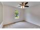 Bright bedroom with neutral carpet, ample natural light from the window, and ceiling fan at 4255 Brandy Ann Dr, Acworth, GA 30101