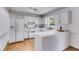 Functional kitchen featuring white cabinets, hardwood floors, and plenty of counter space at 4255 Brandy Ann Dr, Acworth, GA 30101