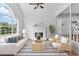 Bright, staged living room with hardwood floors, a fireplace, and views to the adjacent kitchen at 4255 Brandy Ann Dr, Acworth, GA 30101