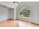 Spacious living room with vaulted ceilings, hardwood floors, and a large window at 4255 Brandy Ann Dr, Acworth, GA 30101