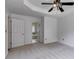 Main bedroom featuring neutral carpet, a ceiling fan, and an ensuite bathroom at 4255 Brandy Ann Dr, Acworth, GA 30101