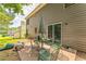 Cozy backyard patio area featuring a table with chairs, and an umbrella for outdoor relaxation at 4945 Penscot Way, Stone Mountain, GA 30088
