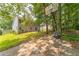 Backyard with a sport court and cozy patio seating, ideal for entertainment and outdoor enjoyment at 4945 Penscot Way, Stone Mountain, GA 30088