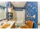 Full bathroom with floral wallpaper, shower/tub combo, and vanity at 4945 Penscot Way, Stone Mountain, GA 30088