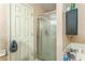 Bathroom featuring glass-enclosed shower and storage shelves at 4945 Penscot Way, Stone Mountain, GA 30088