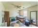 A cluttered bedroom with a ceiling fan, and an assortment of furnishings at 4945 Penscot Way, Stone Mountain, GA 30088