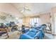 Bright living room featuring a unique ceiling fan and mirrored wall at 4945 Penscot Way, Stone Mountain, GA 30088
