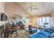 Comfortable living room with multiple couches and a fan, perfect for entertaining and relaxing at 4945 Penscot Way, Stone Mountain, GA 30088