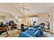 Inviting living room with plush seating and a fan, creating a comfortable and relaxing atmosphere at 4945 Penscot Way, Stone Mountain, GA 30088