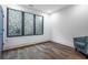 Bright bedroom with hardwood floors and a large window view at 77 Krog Ne St, Atlanta, GA 30307