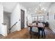 Open-concept dining area with hardwood floors and modern lighting at 77 Krog Ne St, Atlanta, GA 30307
