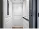 Interior of a modern elevator with paneled walls and lighting at 77 Krog Ne St, Atlanta, GA 30307