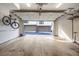 Open garage with concrete floor, overhead lighting and a bike hanging on the wall at 77 Krog Ne St, Atlanta, GA 30307