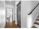 Hallway featuring hardwood floors leading to a bedroom with a large window at 77 Krog Ne St, Atlanta, GA 30307