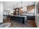 Open kitchen features a spacious island with seating and stainless steel appliances at 77 Krog Ne St, Atlanta, GA 30307