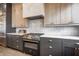 Contemporary kitchen features stainless steel appliances and custom cabinetry at 77 Krog Ne St, Atlanta, GA 30307