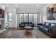 Bright living room with hardwood floors, fireplace, and large windows offers plenty of space at 77 Krog Ne St, Atlanta, GA 30307