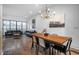 Open concept living and dining areas with hardwood floors and modern decor at 77 Krog Ne St, Atlanta, GA 30307