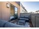 Rooftop patio with stylish furniture and an open sliding glass door to the interior at 77 Krog Ne St, Atlanta, GA 30307
