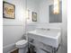 Elegant powder room features a stylish pedestal sink and modern lighting at 77 Krog Ne St, Atlanta, GA 30307