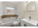 Cozy bathroom with a shower-tub combo, white vanity, and classic fixtures at 1098 Cascade Sw Cir, Atlanta, GA 30311