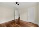 Bedroom with gleaming hardwood floors and two white doors at 1098 Cascade Sw Cir, Atlanta, GA 30311