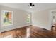 Bedroom with hardwood floors, neutral walls, and natural light from sunlit windows at 1098 Cascade Sw Cir, Atlanta, GA 30311