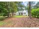 Cozy cottage-style home with lush greenery, presenting a serene and inviting outdoor space at 1098 Cascade Sw Cir, Atlanta, GA 30311