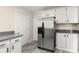 Kitchen with granite countertops, stainless steel refrigerator, and ample cabinet space at 1098 Cascade Sw Cir, Atlanta, GA 30311