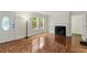 Inviting living room with fireplace, parquet flooring, and a view of the yard at 1098 Cascade Sw Cir, Atlanta, GA 30311