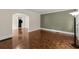 Open living space with parquet floors, archway, and an adjacent kitchen view at 1098 Cascade Sw Cir, Atlanta, GA 30311