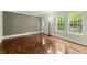 Cozy living room with parquet flooring, bright windows, and neutral walls at 1098 Cascade Sw Cir, Atlanta, GA 30311