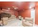 Unfinished basement with a drop ceiling, projector, and home theater seating at 118 Surge Stone Ln, Stockbridge, GA 30281