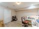 Cozy basement with neutral walls, carpet, and a built-in desk perfect for an office at 118 Surge Stone Ln, Stockbridge, GA 30281