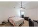 Bedroom featuring a neutral carpet, ceiling fan, and patterned ceiling at 118 Surge Stone Ln, Stockbridge, GA 30281