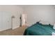 Bedroom featuring a neutral carpet, white doors, and four drawer dresser at 118 Surge Stone Ln, Stockbridge, GA 30281